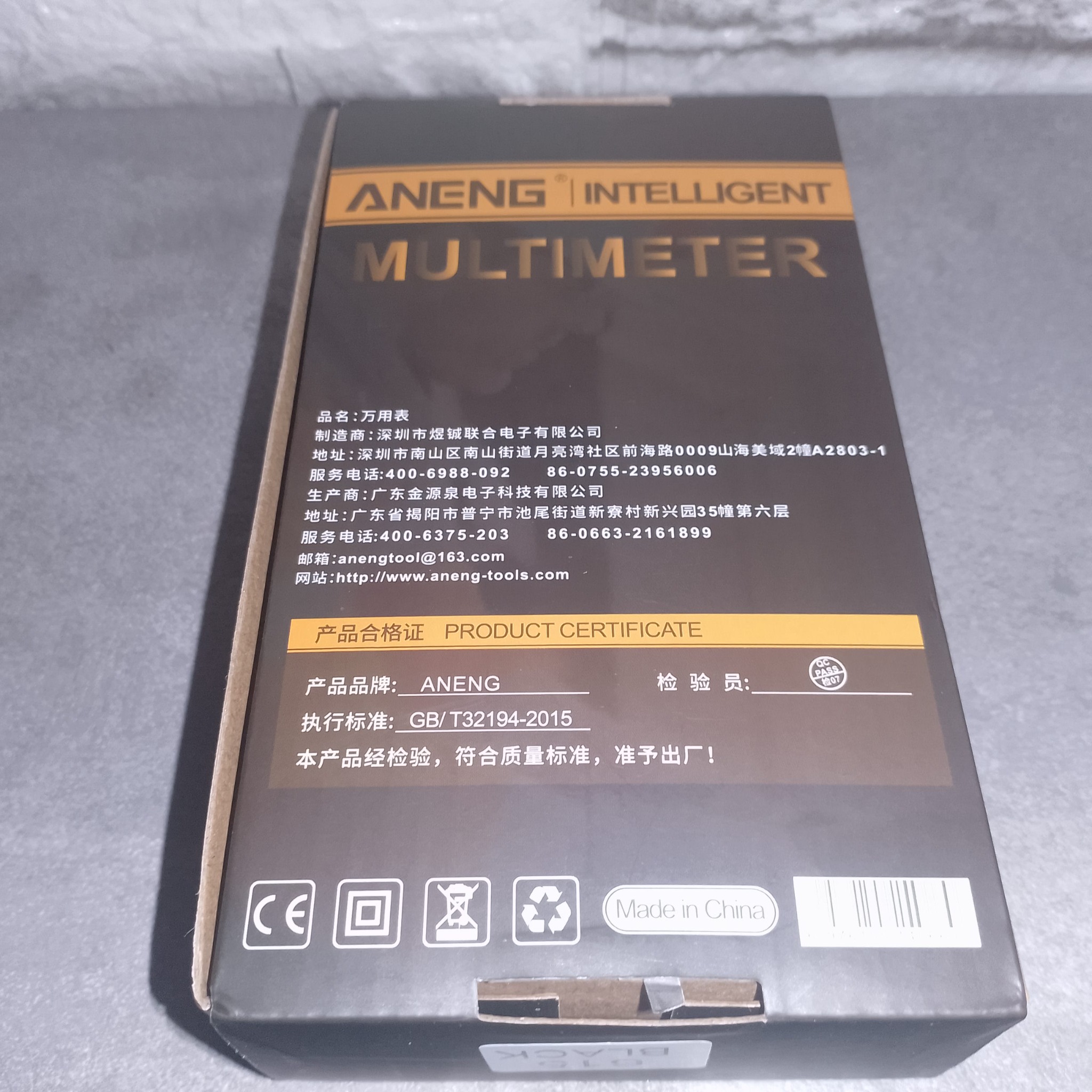 Задняя сторона коробки ANENG 615 с информацией производителя